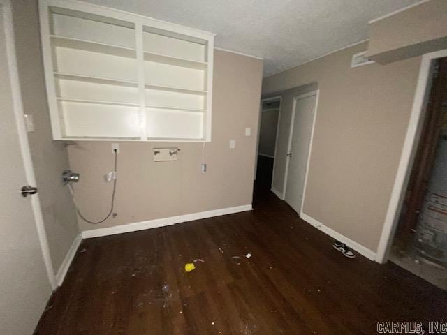 clothes washing area with dark hardwood / wood-style flooring