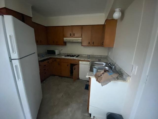 kitchen with sink and white appliances