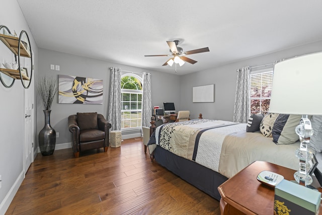 bedroom featuring ceiling fan and dark hardwood / wood-style floors