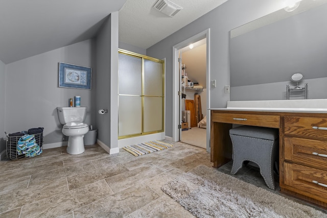 bathroom with vaulted ceiling, toilet, vanity, and a shower with shower door