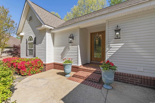 property entrance with a patio