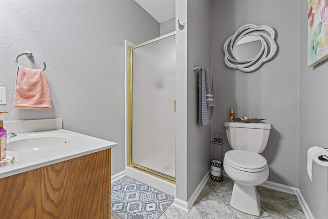 bathroom featuring tile patterned floors, vanity, toilet, and an enclosed shower