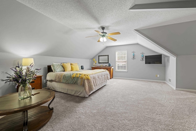 carpeted bedroom featuring vaulted ceiling, ceiling fan, and a textured ceiling