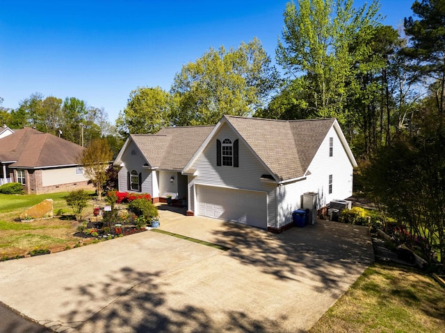 view of front of home featuring a garage and a front yard