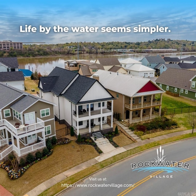 aerial view with a residential view and a water view