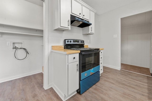 kitchen with electric stove, a textured ceiling, light hardwood / wood-style flooring, and white cabinets