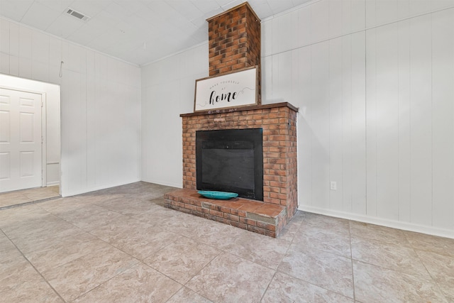 unfurnished living room with a fireplace and ornamental molding