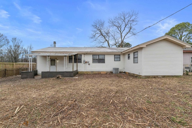 back of house featuring cooling unit and covered porch