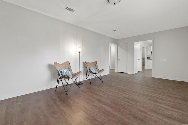 unfurnished room with dark wood-type flooring