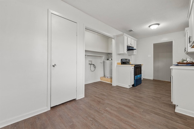 kitchen with electric stove, white cabinetry, dark wood-type flooring, and a textured ceiling