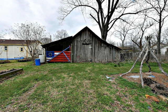 view of outdoor structure with a lawn