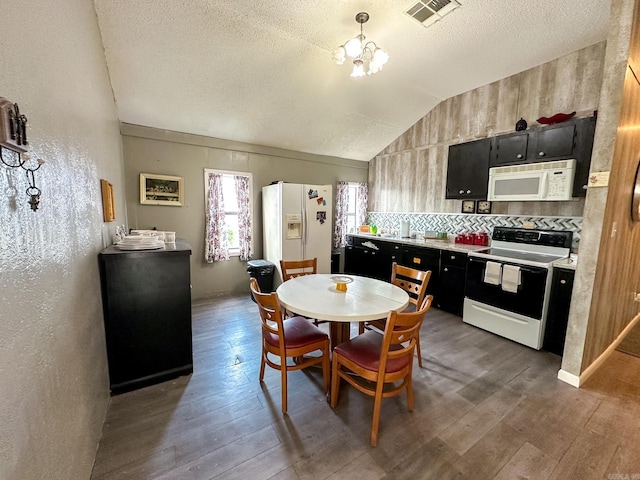 kitchen featuring lofted ceiling, white appliances, dark hardwood / wood-style floors, a textured ceiling, and decorative backsplash