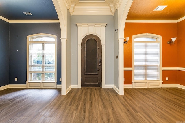 entryway featuring crown molding and dark hardwood / wood-style floors