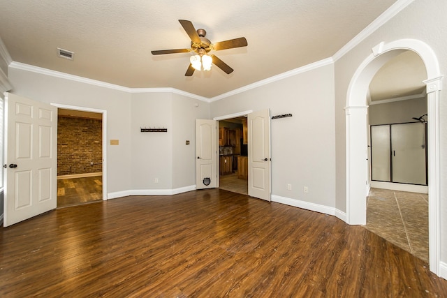 unfurnished room featuring crown molding, dark wood-type flooring, and ceiling fan