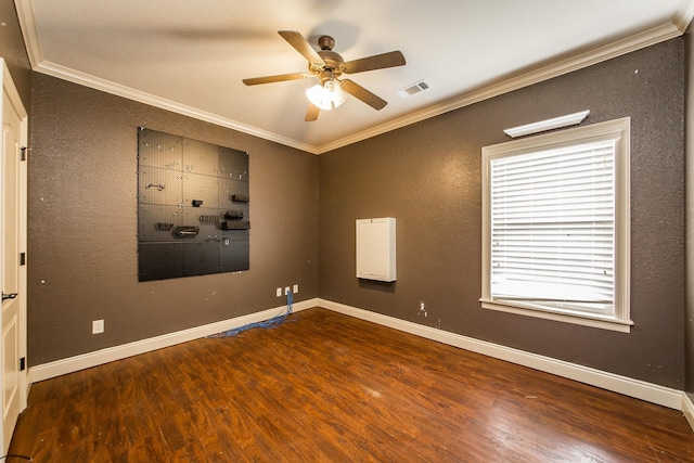 empty room featuring ceiling fan, ornamental molding, and hardwood / wood-style floors