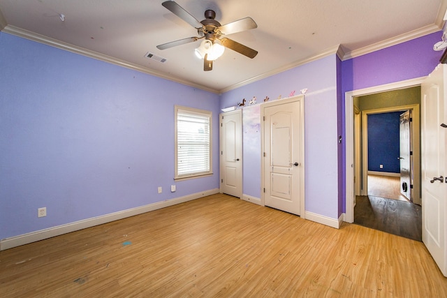 unfurnished bedroom featuring ceiling fan, ornamental molding, and light hardwood / wood-style floors