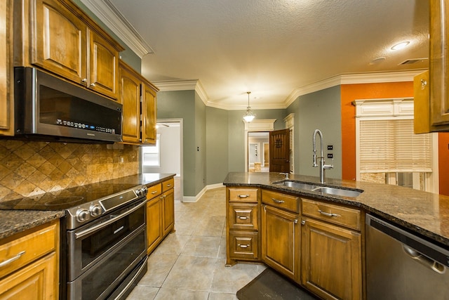 kitchen featuring light tile patterned flooring, sink, ornamental molding, appliances with stainless steel finishes, and decorative backsplash