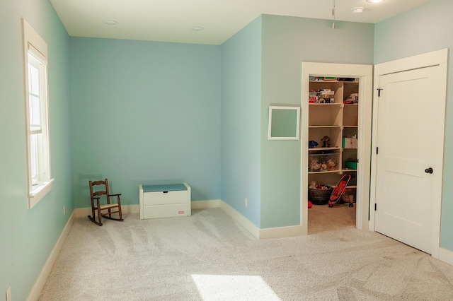 empty room featuring carpet and plenty of natural light