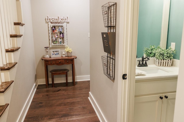 hall featuring dark hardwood / wood-style flooring and sink