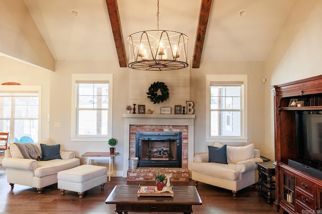 living room with dark hardwood / wood-style floors, a chandelier, and vaulted ceiling with beams