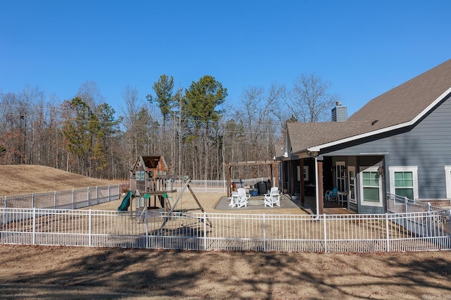 view of yard with a patio and a playground