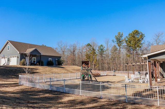 view of yard featuring a patio and a playground