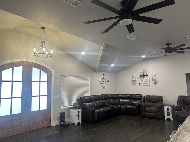 living room with french doors, dark hardwood / wood-style floors, and vaulted ceiling