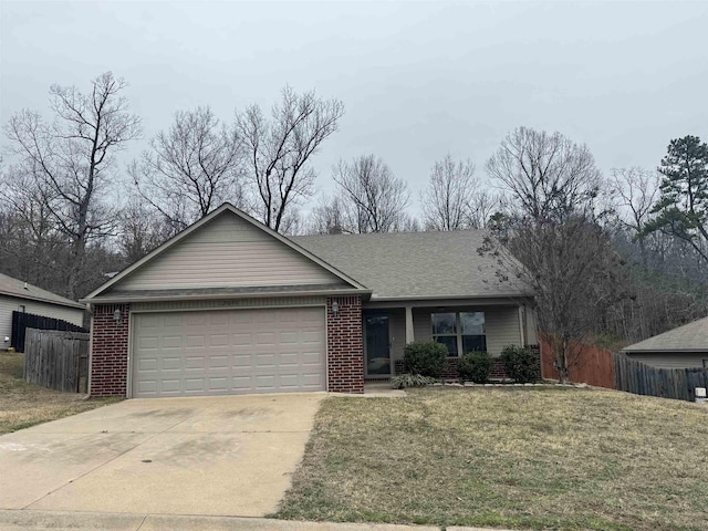 single story home featuring a garage and a front lawn