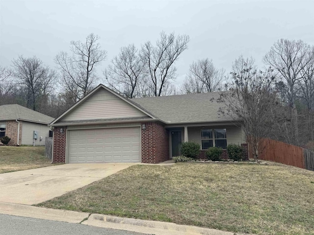 single story home featuring a garage and a front yard