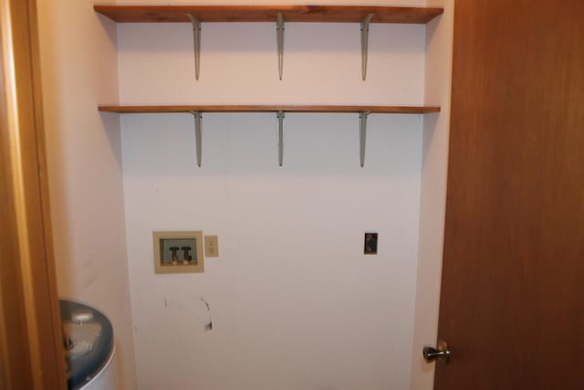 clothes washing area with hookup for a washing machine and hookup for an electric dryer