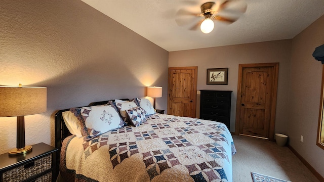 bedroom featuring ceiling fan and carpet