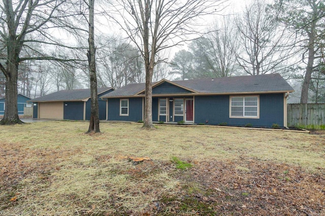 ranch-style home with a front lawn