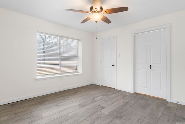 unfurnished bedroom featuring ceiling fan and light hardwood / wood-style floors