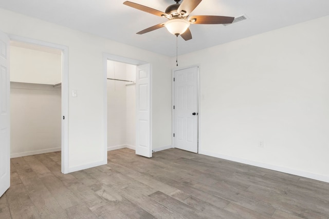 unfurnished bedroom featuring ceiling fan and light wood-type flooring