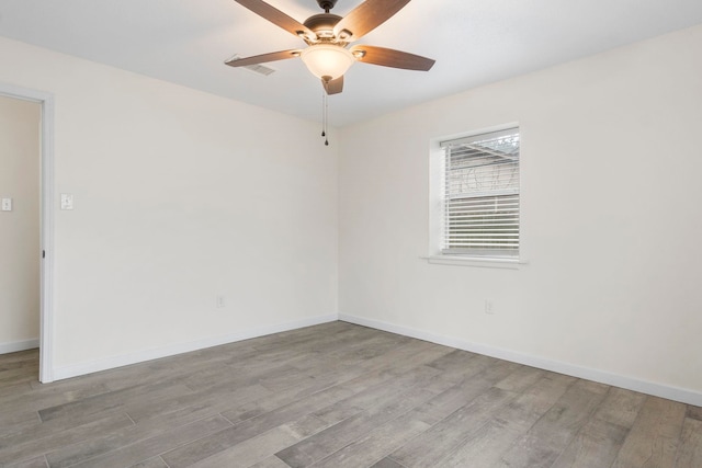 empty room featuring ceiling fan and light wood-type flooring