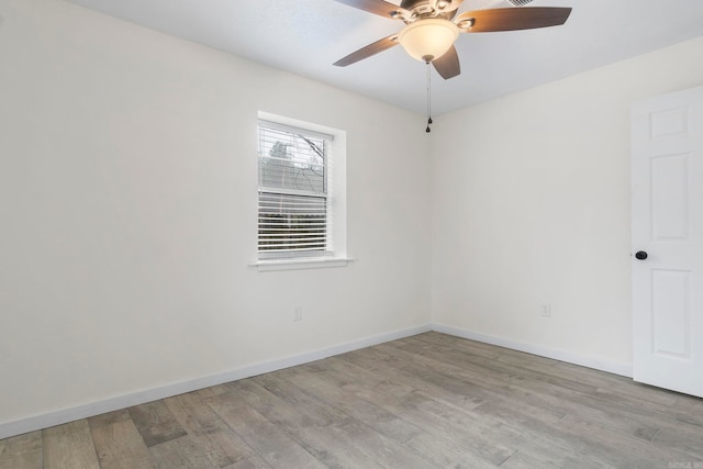 spare room with light hardwood / wood-style floors and ceiling fan