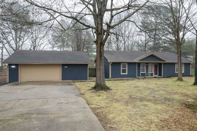 ranch-style house with a garage and a front yard