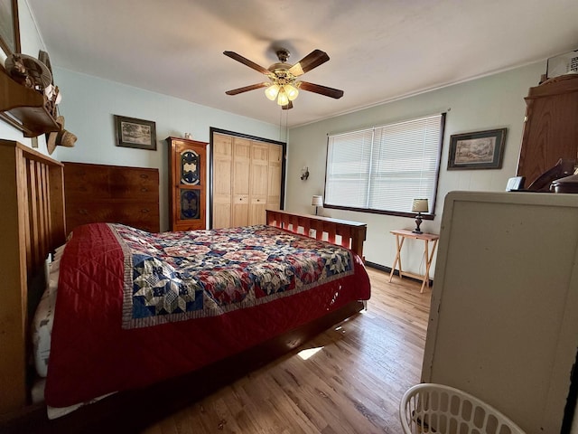 bedroom with hardwood / wood-style flooring and ceiling fan