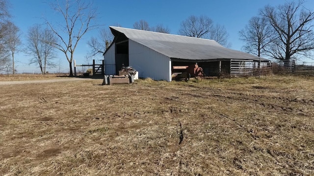 view of home's exterior featuring an outbuilding