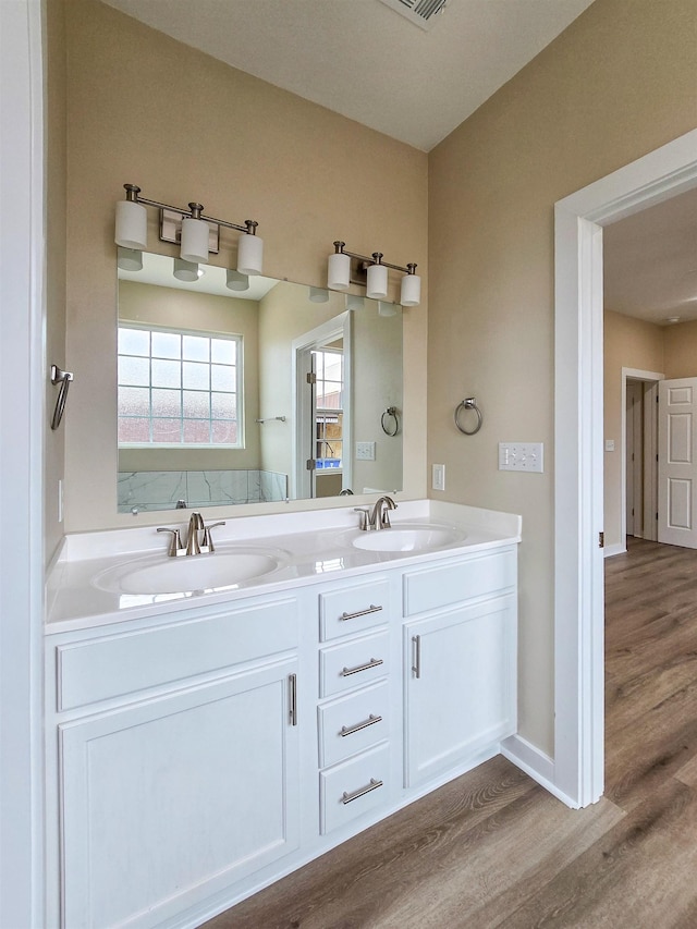 111 Brigance St, Marked Tree, AR 72365 - bathroom featuring vanity and hardwood / wood-style flooring