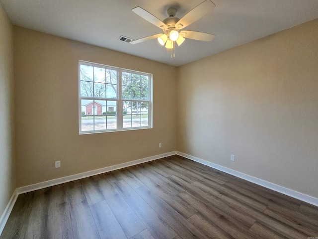 111 Brigance St, Marked Tree, AR 72365 - unfurnished room featuring dark wood-type flooring and ceiling fan