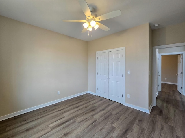 111 Brigance St, Marked Tree, AR 72365 - unfurnished bedroom with wood-type flooring, ceiling fan, and a closet