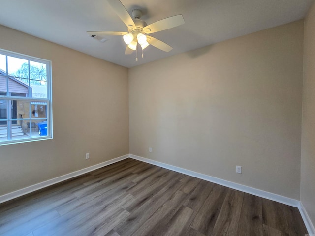 111 Brigance St, Marked Tree, AR 72365 - unfurnished room featuring dark wood-type flooring and ceiling fan