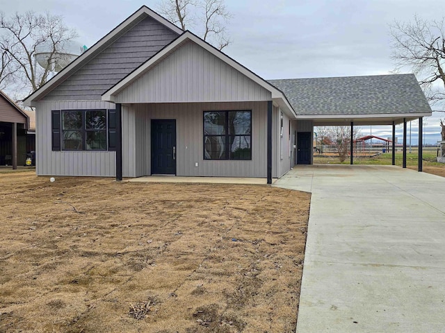 111 Brigance St, Marked Tree, AR 72365 - view of front of home with a carport