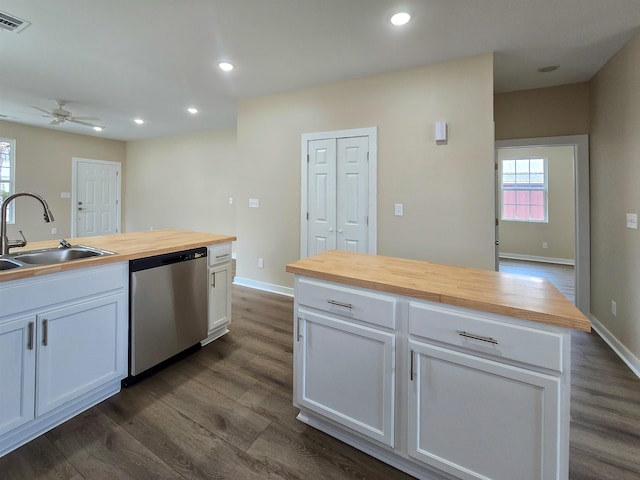 111 Brigance St, Marked Tree, AR 72365 - kitchen featuring sink, wooden counters, dishwasher, white cabinetry, and a kitchen island with sink