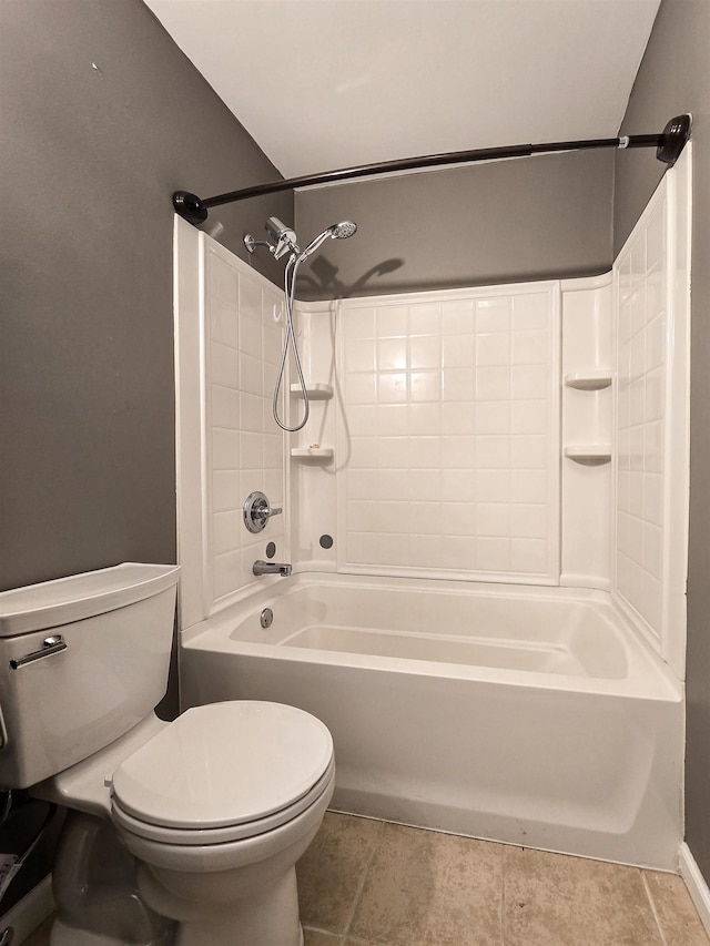 bathroom with tile patterned floors, toilet, and shower / bath combination