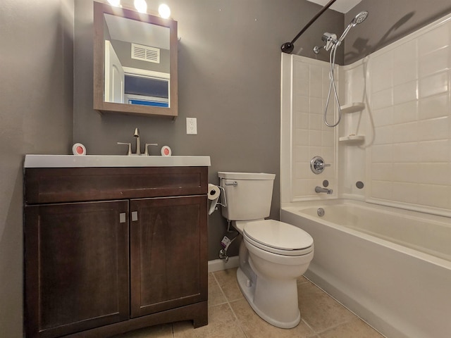 full bathroom featuring tile patterned flooring, bathing tub / shower combination, vanity, and toilet