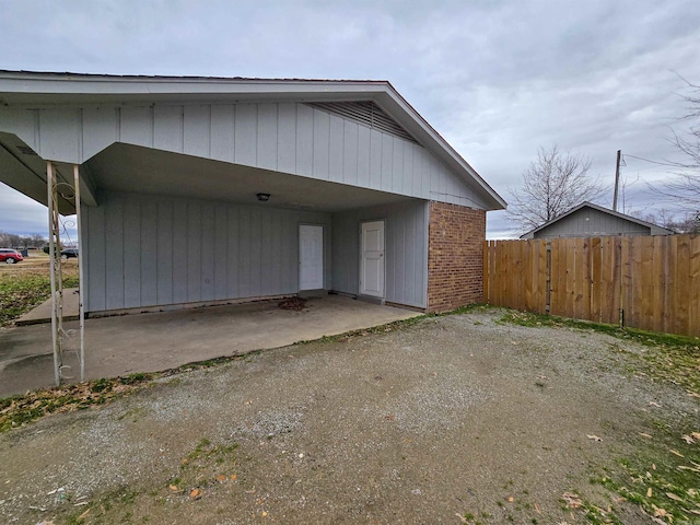 exterior space with a carport