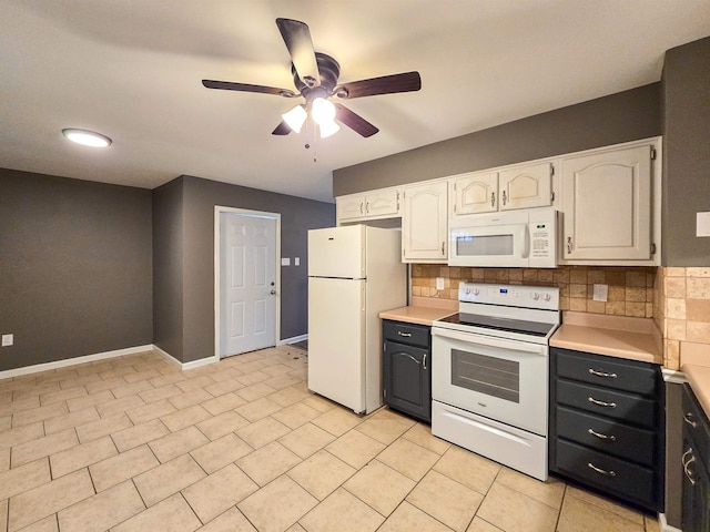 kitchen featuring backsplash, light tile patterned floors, white cabinets, and white appliances