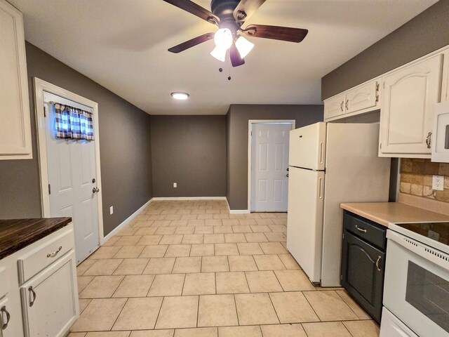 kitchen featuring white appliances, ceiling fan, white cabinetry, tasteful backsplash, and light tile patterned flooring